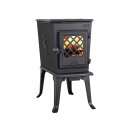 Jotul F 602 ECO im Wohnzimmer vor einer Backsteinwand.